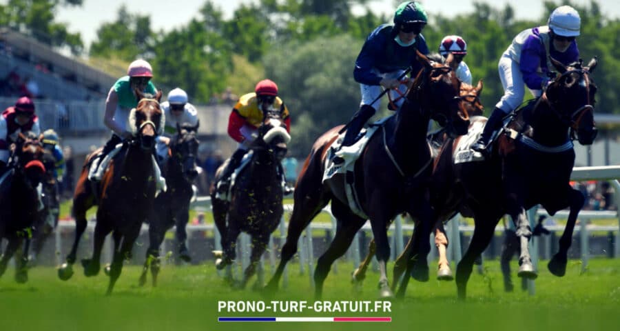 Horse race scene with several jockeys in colorful silks riding fast horses on a track; foreground shows green grass and a banner text 'PRONO-TURF-GRATUIT.FR' at the bottom.